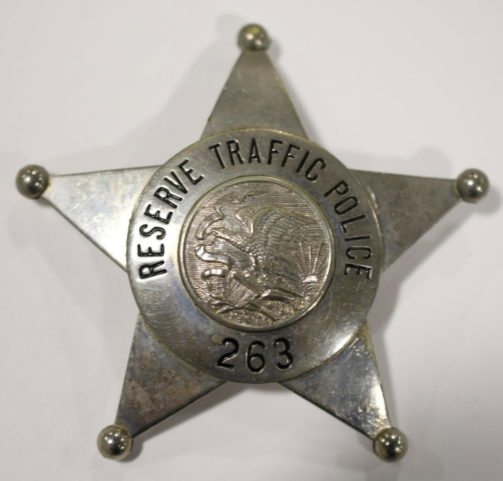 Obsolete Illinois Reserve Traffic Police Badge: Nice obsolete 5-point star Illinois Reserve Traffic Police badge no.263. Badge is in nice condition with pinback. Back is marked " C.H. Hanson". It measures approximately 2-1/2" tall by 2-1/2" across.
