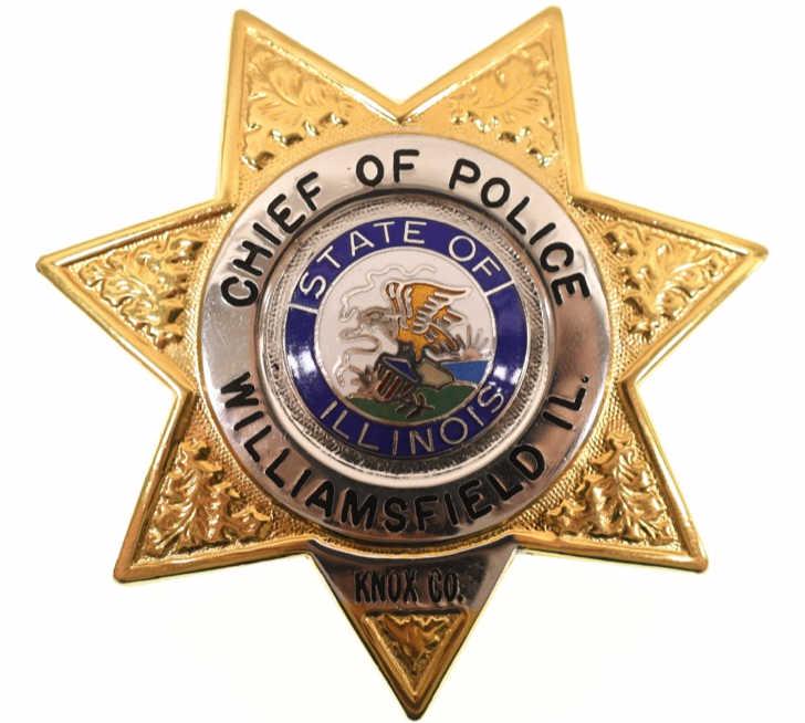 Obsolete Williamsfield IL. Chief Of Police Badge: Nice obsolete seven-point star Williamsfield Illinois Police badge. Badge is in nice condition with pinback. Back is marked "E Ross". Badge measures approximately 2-3/4" tall by 2-1/2" across.