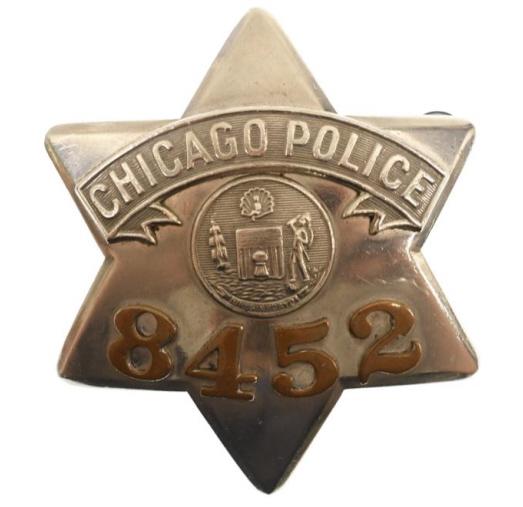 Obsolete Chicago Police Pie Plate Badge #8452: Nice obsolete Chicago Police Pie Plate Badge #8452 with copper numbers. Badge is in nice condition with pinback. Back is maker marked C.H. Hanson Chicago. It measures approximately 3-1/2" tall by 3" a