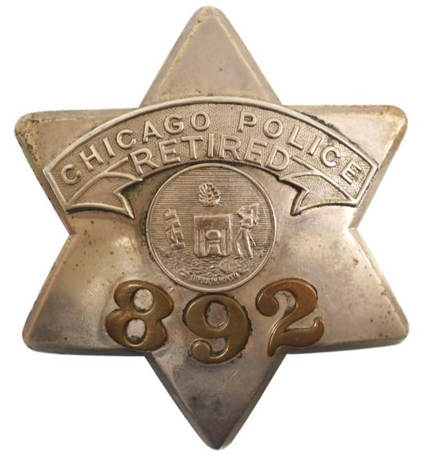 Obsolete Chicago Police Retired Pie Plate Badge: Nice obsolete Chicago Police Retired Pie Plate Badge #892 with copper numbers. Badge is in nice condition with pinback. Back is maker marked C.H. Hanson Chicago. It measures approximately 3-1/2" tall
