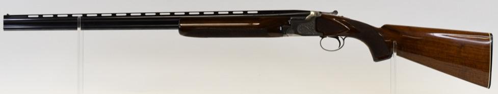 Winchester Model 101 .410 Over & Under Shotgun: Very nice Japanese Winchester Model 101 Pigeon Grade over & under shotgun in .410 gauge. The shotgun has a 28" vented barrel with checked grip and forearm, deluxe wood, and engraving. It is in great c