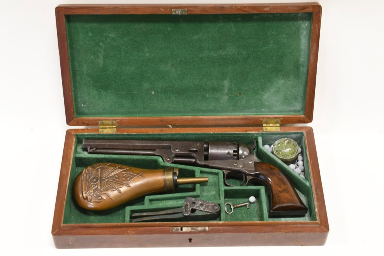 Colt Model 1851 London Navy .36 Cal. Revolver: Nice Colt Model 1851 London Navy .36 caliber 6-shot revolver. The revolver comes cased with mold & flask. Manufactured in 1855 and is in good condition with some surface and age wear. Matching serial 