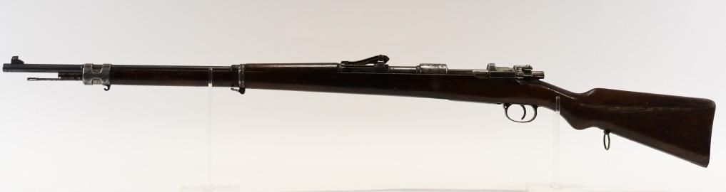 Peruvian Mauser Model 1909 7.65x53mm Rifle: Nice Peruvian contract Mauser Model 1909 bolt action rifle in 7.65x53mm. The rifle has a 29.5" barrel and is in good used condition with use wear. SN:26448. FFL required for transfer. (188-3)