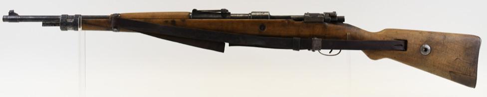 WWII German Mauser 98 Bolt Action Rifle 7.92x57: 1939 WWII German Mauser Model 98 bolt action military rifle in 7.92 x 57mm. The rifle has a 24" barrel and is in good used condition with wear. Rifle includes Nazi Eagle stamps on the reciever and sto