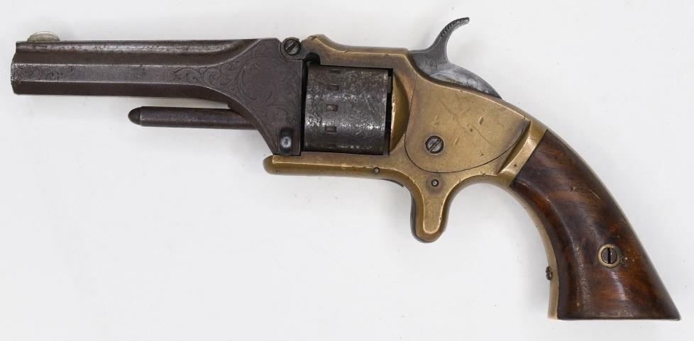 1860's Manhattan .22 Cal. Seven-Shot Revolver: Nice 1860's Manhattan Firearms Co. seven-shot revolver in .22 caliber. The brass framed first variation revolver has a 3" barrel and is in good condition with some age and use wear. Has Cowboy & India