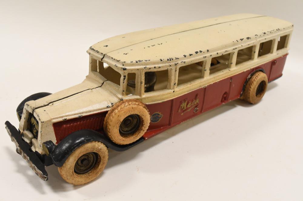 Arcade "Mack 6" Bus: Nice Arcade "Mack 6" Bus cast iron circa 1929. Red & White boxy with black accents. "Mack " embossed on sides with gold lettering, nickel driver, side mount tire. Measures approximately 13" long. Over