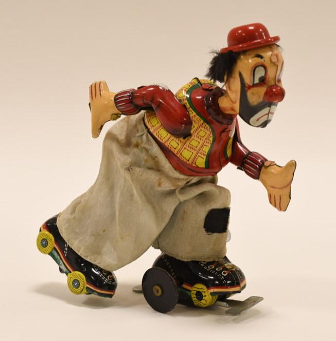 Japan Tin Litho Wind-Up Roller Skating Clown (1 of 4)
