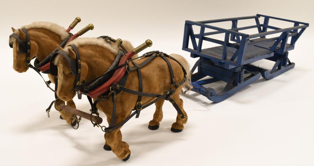 Custom Team of Horses and Sleigh: Nice custom team of horses and sleigh. Displays nicely, but does need a light cleaning. Has dust and wear from display and storage. Overall measures approximately 29 1/2" long.