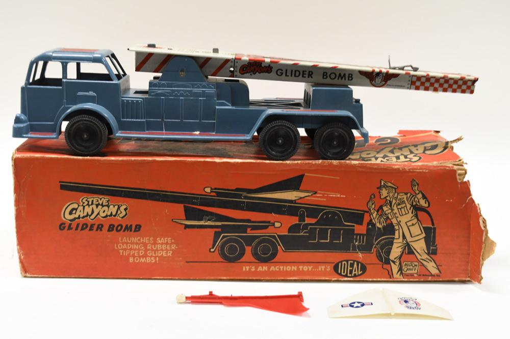 Ideal Toys Steve Canyon's Glider Bomb: Comes with original box. Box is missing some flapson the one end. The glider is broken. Made of mostly hard plastic. Measures approximately 24" long.