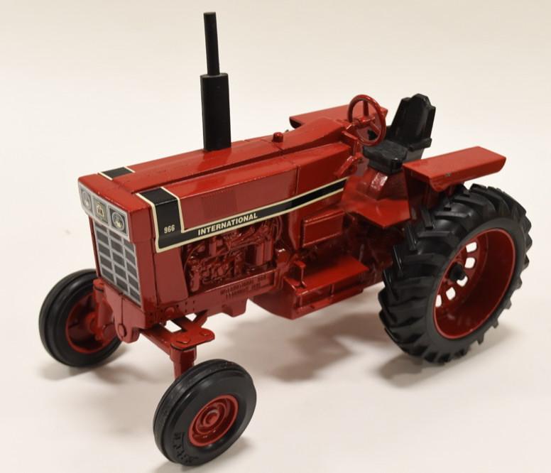 1/16 Ertl IH 966 Tractor: Nice Ertl 1/16 scale die-cast International 966 black stripe tractor. February 1991. In nice condition with light wear from display.