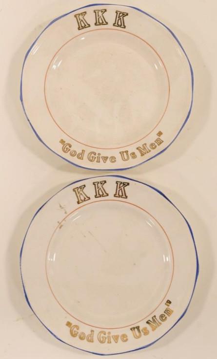 Lot Of 2 Vintage Gold Gilt KKK Plates: Nice lot of 2 vintage Ku Klux Klan gold gilt plates. Both plates are marked "KKK God Give Us Men". Plates were stamped and decorated byCrescent China Co. They are all in nice condition with no cracks.