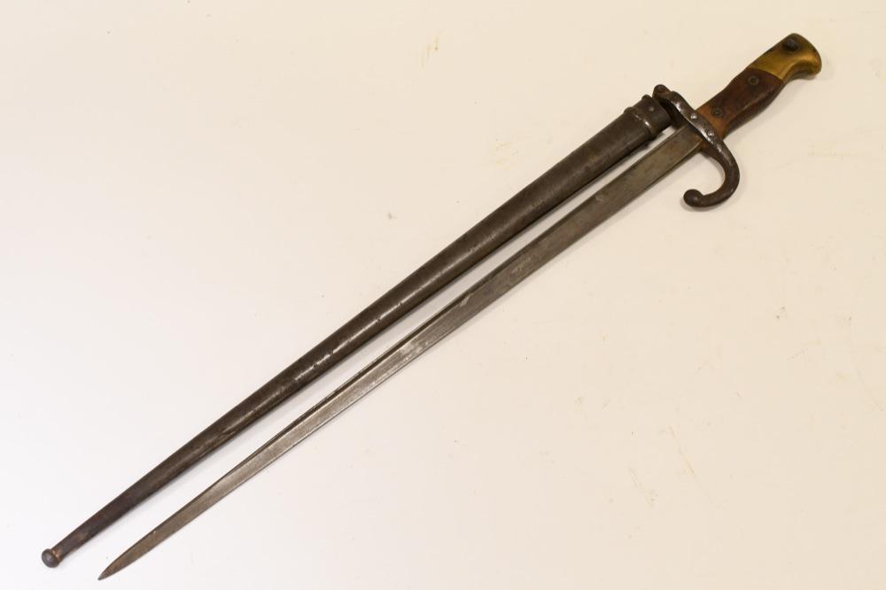 French M1874 Gras Rifle Epee Bayonet w/ Scabbard: Nice French M1874 Gras Rifle bayonet with scabbard. Good condition with pitting and from use and age. Blade is engraved on edge . Bayonet and scabbard do not have matching serial numbers. Overall with