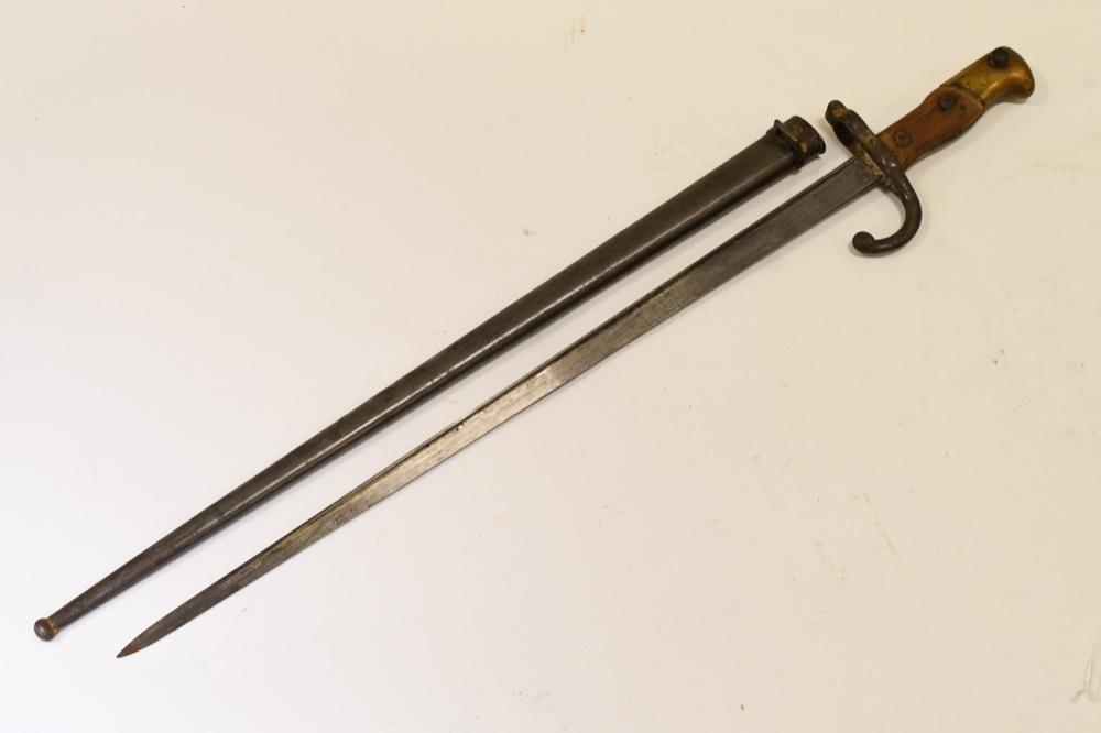 French M1874 Gras Rifle Epee Bayonet w/ Scabbard: Nice French M1874 Gras Rifle bayonet with scabbard. Good condition with pitting and from use and age. Blade is engraved on edge . Bayonet and scabbard do not have matching serial numbers. Blade is mar