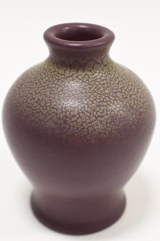 1905 Van Briggle Sharkskin Textured Pottery Vase: Beautiful 1905 Van Briggle sharkskin textured pottery vase. The vase has a mulberry textured matte finish with green accents. Great condition with no chips, cracks, or crazing. Measures 4-1/4" tall x
