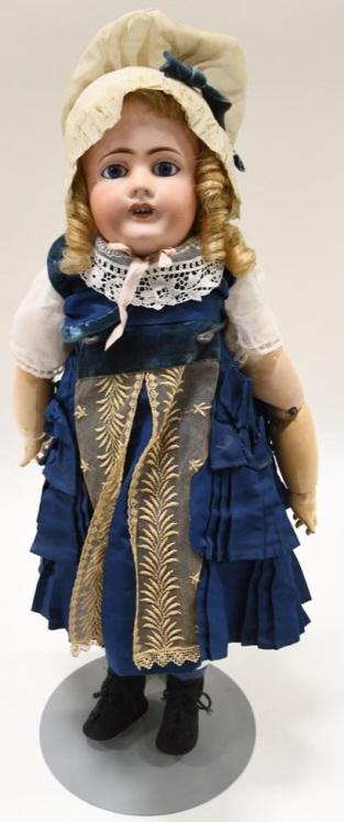 Antique 22" Unis French Porcelain Head Doll: Nice 22" French made Unis #301 porcelain head doll. Doll comes with nice clothes and a jointed composite body. The bisque limoges porcelain head has glass eyes, open mouth, pierced ears and is marked 