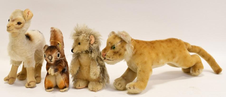 Lot Of 4 Small Vintage Mohair Steiff Animals: Nice lot of four vintage Steiff mohair animals. Lot includes a llama, squirrel, hedgehog, and lioness. They are all in good condition with wear from use and age. The lioness measures approximately 11"
