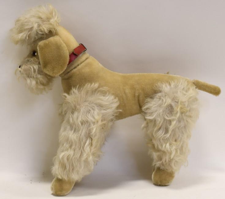 Large Vintage Steiff Mohair Jointed Poodle: Nice large vintage Steiff mohair jointed poodle dog. Good condition with wear from use and age. Has repairable damage to tail area. Does not stand on its own and missing ear tag. It measure approximat