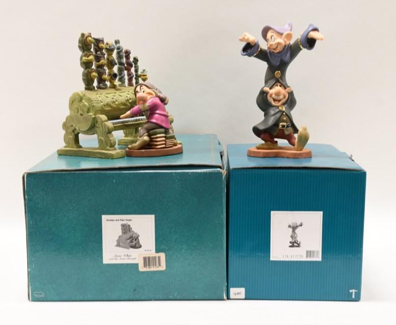 (2) Disney Classics Snow White Dwarf Figurines: Nice lot of two Walt Disney Classics Collection porcelain figurines featuring Snow White and the Seven Dwarfs. Lot Includes Dopey and Sneezy "Dancing Partners" and Grumpy and Pipe Organ. The figurines