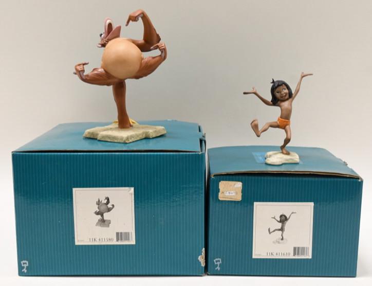 (2) Disney Classics The Jungle Book Figurines: Nice lot of Two Walt Disney Classics Collection porcelain figurines featuring The Jungle Book. Lot includes Mancub and King Louie. The figurines are in nice condition with the original boxes and COA's