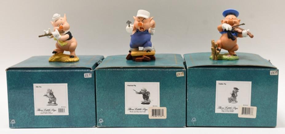 (3) Disney Classics Three Little Pigs Figurines: Nice lot of three Walt Disney Classics Collection porcelain figurines featuring The Three Little Pigs. Lot includes Fiddler pig, Practical Pig, and Fifer Pig. The figurines are in nice condition with