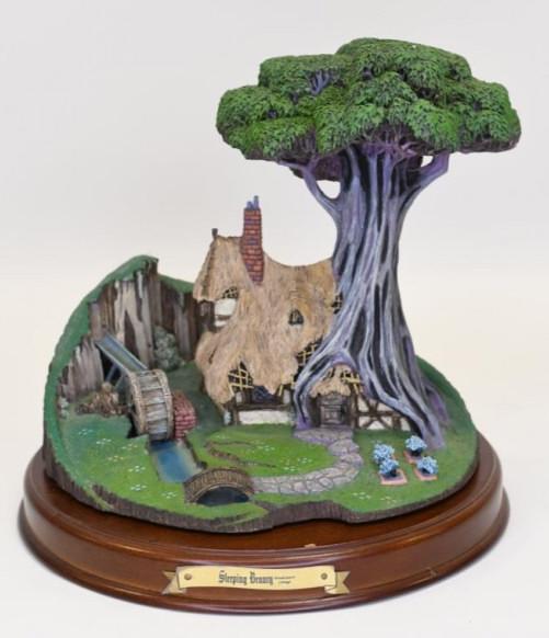 WDCC "Woodcutter's Cottage" Sculpture: Nice Walt Disney Classics Collection resin sculpture titled "Woodcutter's Cottage" from Disney's "Sleeping Beauty". The sculpture is in great condition in the original box with COA and wood base. Meas