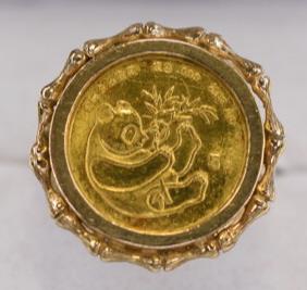 Ladies 14K Gold Ring With 1/10 Oz. .999 Gold Panda: Nice ladies 14k yellow gold coin ring with a 1984 1/10 .999 gold panda coin. The ring is size 6.25 and weighs 4.8 grams.