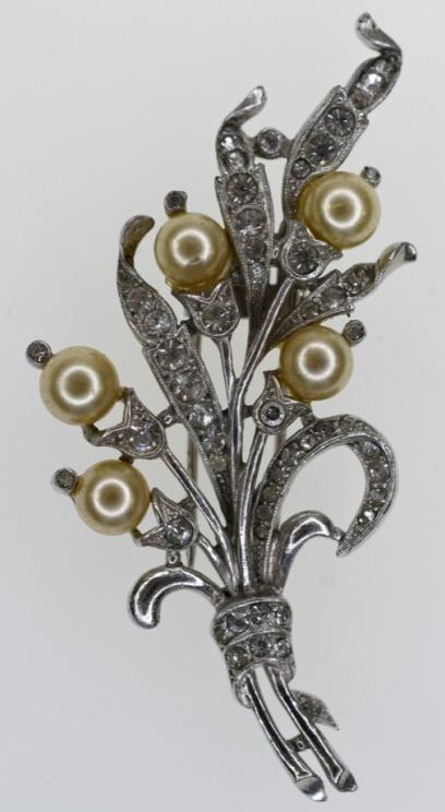 1940's Trifari Rhinestone & Pearl Fur Clip: Very nice 1940's Trifari rhinestone & pearl fur clip. The signed clip measures 1-1/2" across x 2-3/4" tall and is in very nice condition.