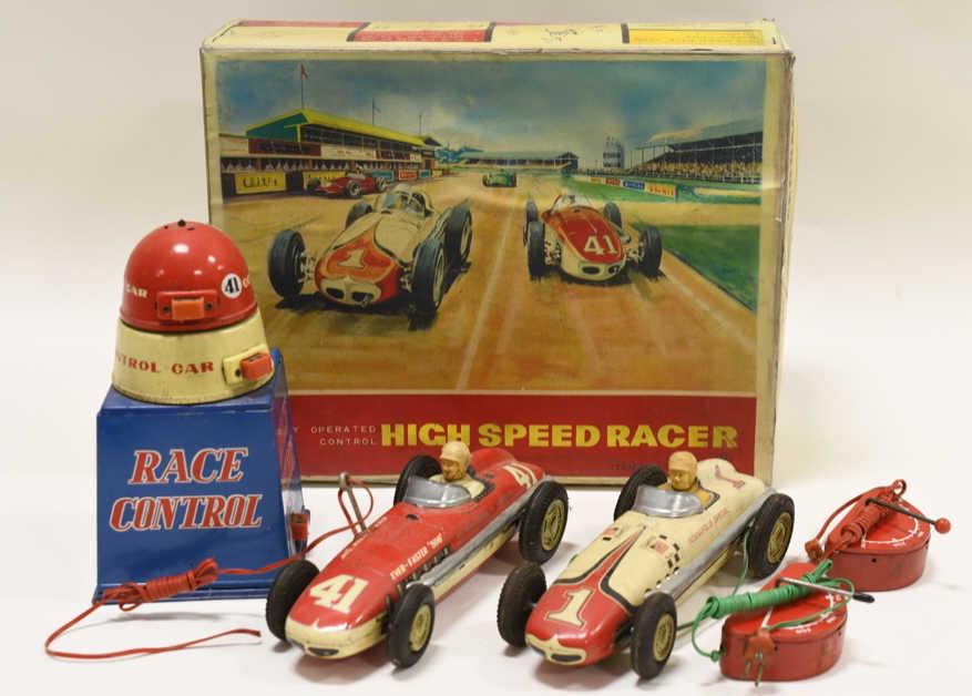 Yonezawa Tin Litho Battery Op. High Speed Racer: Nice Yonezawa tin litho battery operated remote control high speed racer set in a reproduction box. Nice condition with light paint loss and wear. Toy is untested. Box is a reproduction. Box measures