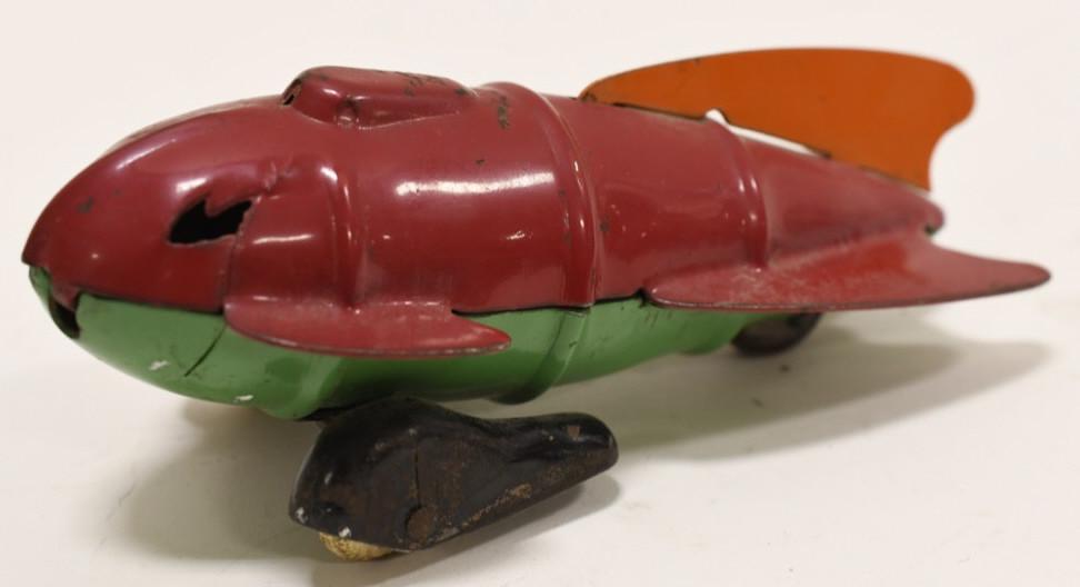 Wyandotte Steel Buck Rogers Space Rocket: Nice Wyandotte pressed steel Buck Rogers space rocket. Dislays nicely with light wear from age and play. Measures approximately 6 1/4" long.