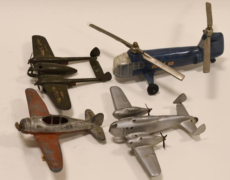 Lot of 4 Vintage Metal Planes and Helicopter: Nice lot of 4 vintage pressed steel planes and helicopters. Lot incluedes Hubley and Wyandotte. All display nicely with light wear considering age. Helicopter measures approximately 9" long.