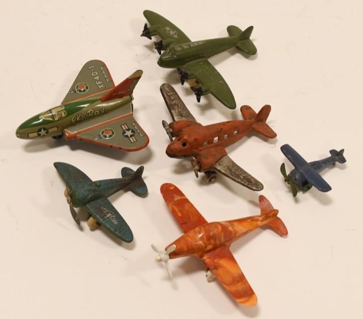 Lot of 6 Toy Planes Tin, Cast, and Plastic: Nice lot of 6 toy planes. Lot includes tin, cast, and plastic planes.All display nicely with wear from age and play. Longest wingspan measures approximately 4" long.