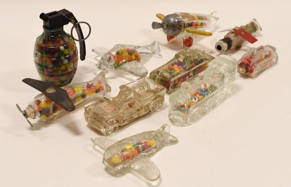 Lot of 10 Vintage Glass Candy Jars: Nice lot of 10 vintage glass candy jars. Some have chips and wear. Grenade is plastic. Longest measures approximately 5" long.