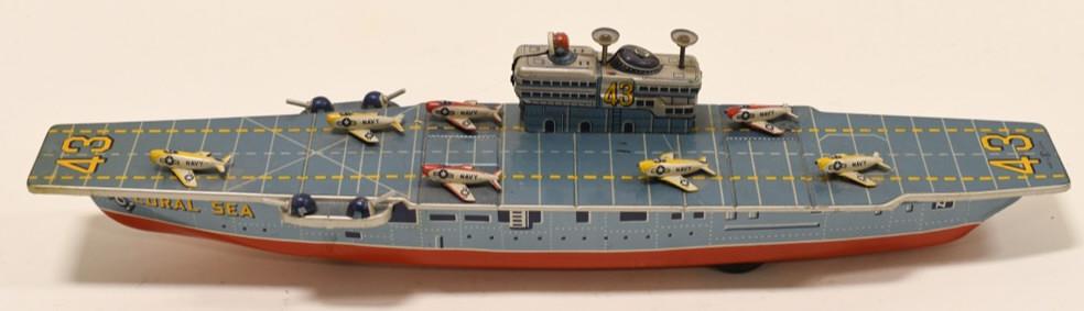 Bandai Tin Friction Coral Sea Aircraft Carrier: Nice Bandai Japan tin friction Aircraft Carrier and Helicopter. DIsplays nicely with light wear from play and age. Friction is in working condition. Measures approximately 15" long.