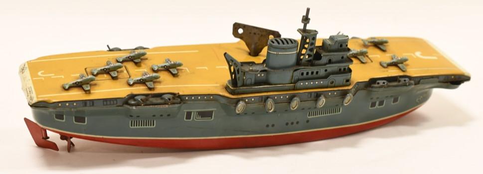 Marusan Toy Tin Litho Windup USAF Aircraft Carrier: Nice Japan Marusan Toys tin litho windup USAF aircraft carrier. Displays nicely with light paint loss and wear from play and age. Windup is in working condition. Measures approximately 15" long.