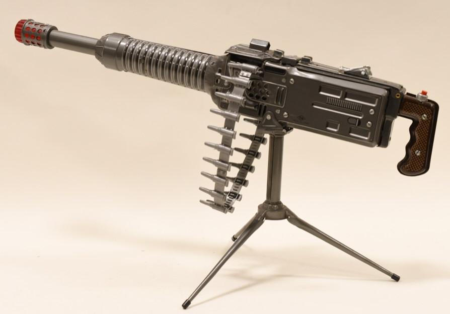 Nomura Tin Litho Battery Op. Heavy Machine Gun: Nice Nomura tin litho battery operated heavy machine gun with tri-pod. Battery compartment is clean. Displays nicely with light wear from play and age. Measures approximately 23" long.