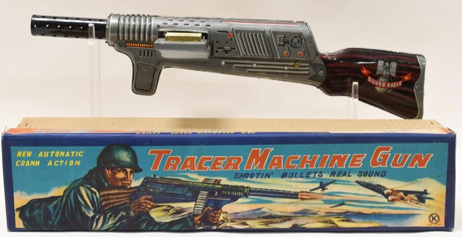 Japan Tin Tracer Crank Action Machine Gun: Nice Japan tin litho Tracer crank action machine gun with box. Comes with some ammunition. Displays nicely with light wear from play and age. Measures approximately 21" long.