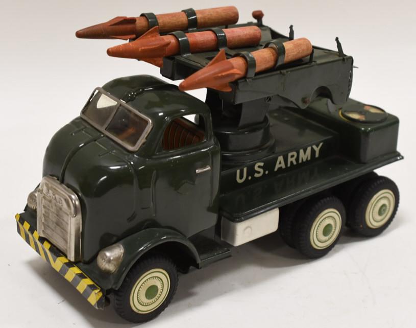 Yonezawa Tin Friction GMC Rocket Launcher Truck: Nice Yonezawa tin litho friction GMC rocket launcher truck. Toy displays nicely with light wear from play and age. Comes with 3 rockets. Some of the rockets wings are broke. Measures approximately 5 1