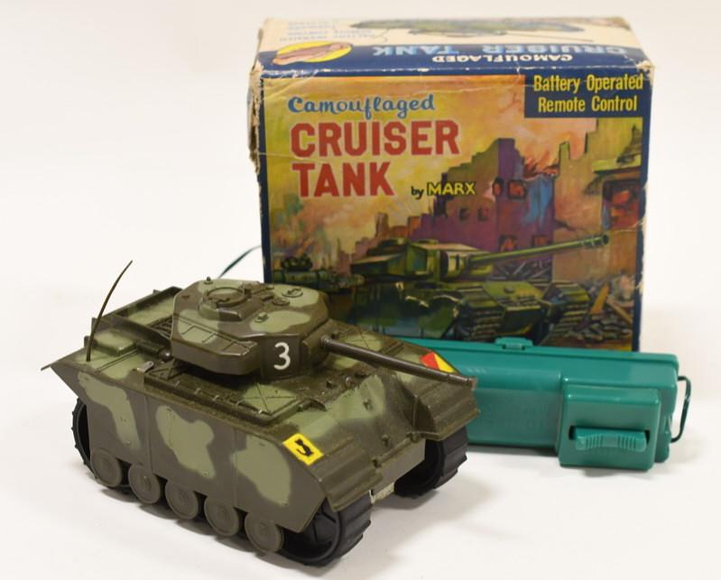 Marx Camouflaged Cruiser Tank Battery Operated: Nice Marx Camouflaged Cruiser Tank made of plastic. It is battery operated with a remote control. Untested. Displays well with original box. Box and toy are in nice condition with light wear from age.