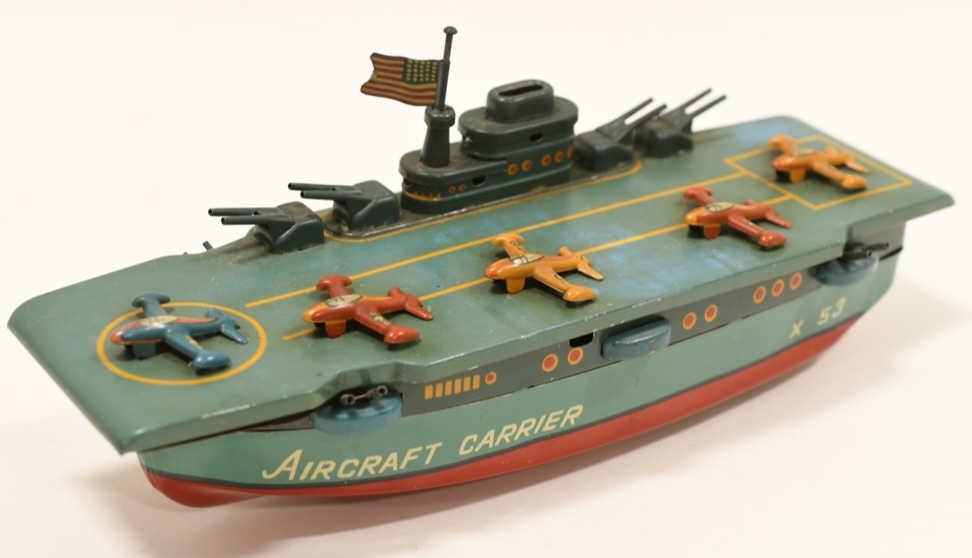 Yonezawa Tin Friction Aircraft Carrier X 53: Nice tin litho friction Yonezawa X 53 aircraft carrier. Displays nicely with paint loss and wear from play and age. Working condition. Makes a gun like popping noise when the wheels are turned. Measur