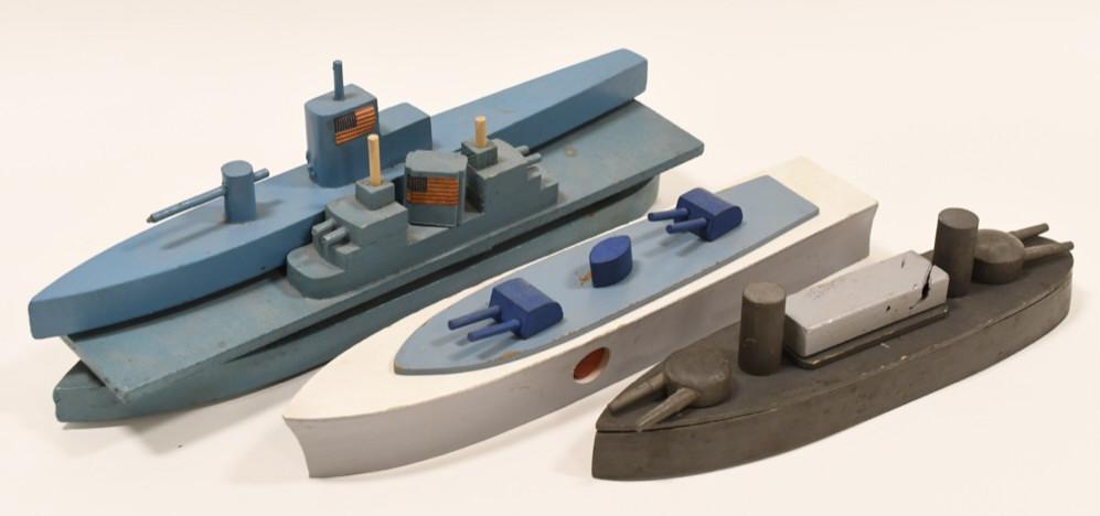 Wood WWll Battleship, Aircraft Carrier, Submarine: Nice lot of WWll battleship, aircraft carrier and submarine. The aircraft carrier and submarine are velmade toys. The Battleship is a blow-up ship. Longest measures approximately 13" long.