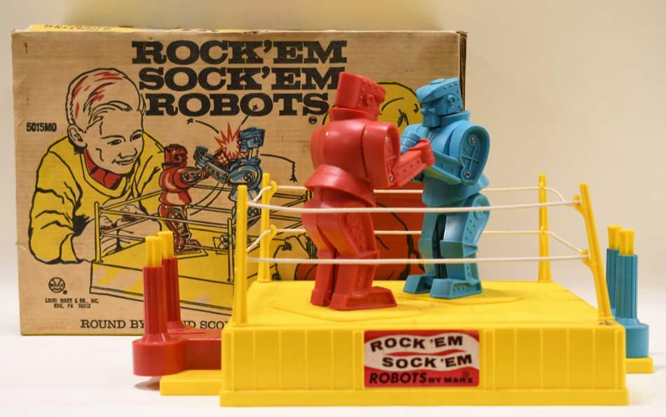Marx Rock 'Em Sock 'Em Robots: Nice vintage Marx Rock 'Em Sock 'Em robots with the box. Robots are dusty and have wear from play and age. Box displays nicely with dust and staining from storage. One of the posts has been replaced a