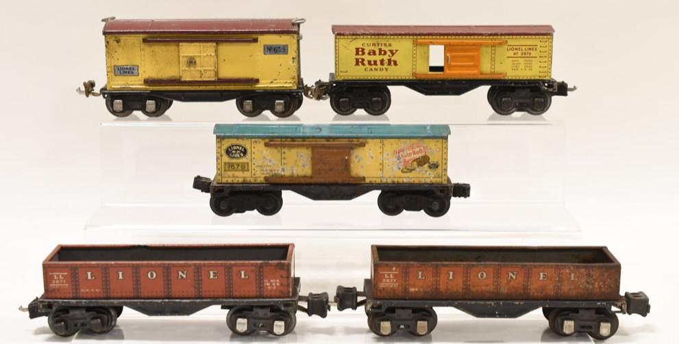 Lot of Lionel Prewar Box Cars & Gondolas: Nice lot of Lionel prewar box cars and gondolas. Includes Lionel 1679 Baby ruth box car, Lionel 2679 Baby Ruth Box Car, 2 Lionel #2677 Gondola, and a Lionel #655 boxcar. All have wear and paint loss f