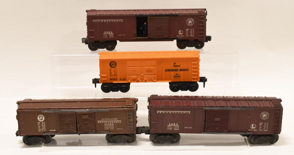Lot of Postwar Lionel O Gauge Box Cars: Nice lot of Lionel O Gauge Box Cars. Includes Lionel #X2458 Pennsylvania box car, (2) #3484 Pennsylvania one with guy and one without, also #6024 Shreded Wheat box car.