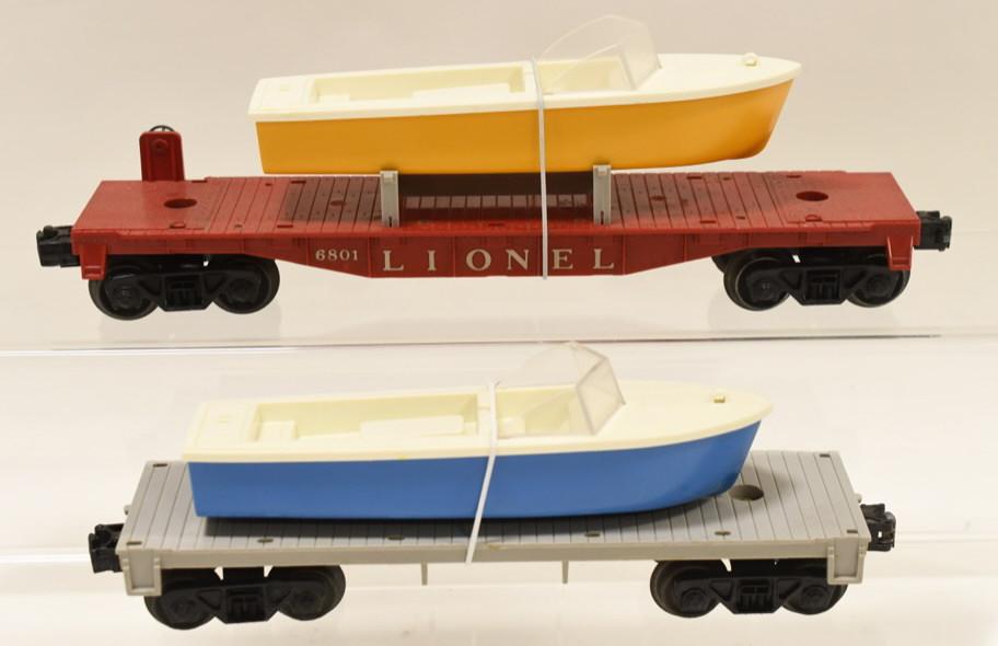 Lionel #6801 Boat Car and #6402 Flat Car: Nice Lionel #6801-50 boat car with replacement boat and #6402 type lll flat car with replacement boat. Displays nicely with wear from play and age.