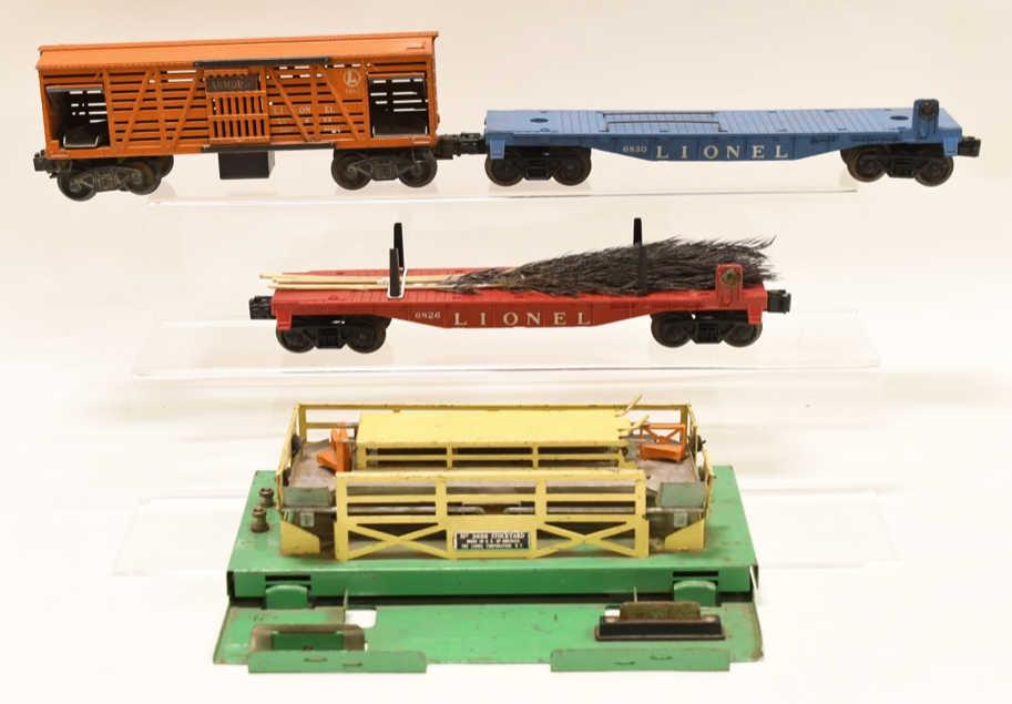 Lot of Lionel Cars and Cattle Stockyard: Nice Lionel #6830 sub car, #6826 Christmas tree car, #3656 Cattle Car, also includes a Lionel No. 3656 stockyard. Displays nicely with wear from age and play.