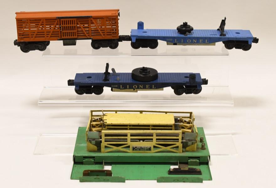 Lionel Helicopter Cars, Cattle Car, and Stockyard: Nice Lionel #3656 Cattle Stockyard and #3656 Cattle Car. Also includes a #3410 helicopter car (missing helicopter) and #3419 helicopter car (missing helicopter). All display nicely with wear from age 
