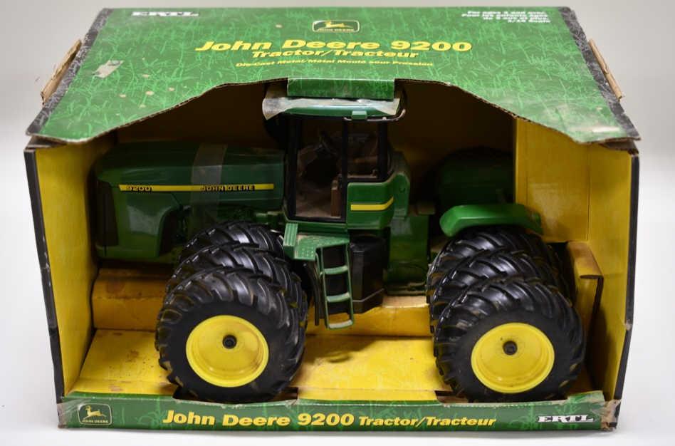 1/16 Ertl John Deere 9200 w/ Triples: Nice 1/16 scale Ertl John Deere 9200 with triples. Tractor is dusty and has wear from display and storage. Box also has dust and wear from display.