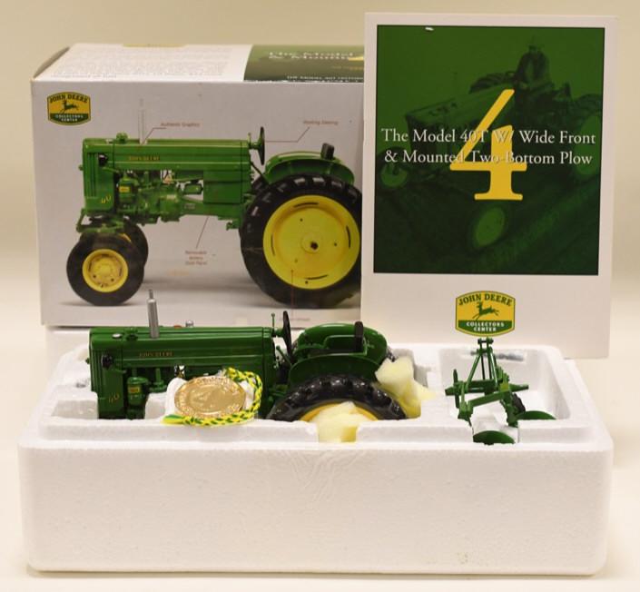 1/16 Ertl John Deere Model 40T WF w 2-Bottom Plow: Nice 1/16 scale Ertl John Deere Model 40T Wide Front & Mounted two-bottom plow. Collectors Center #4 precision. Toy is in nice condition in the original box. Displays nicely. Toy appears to have never