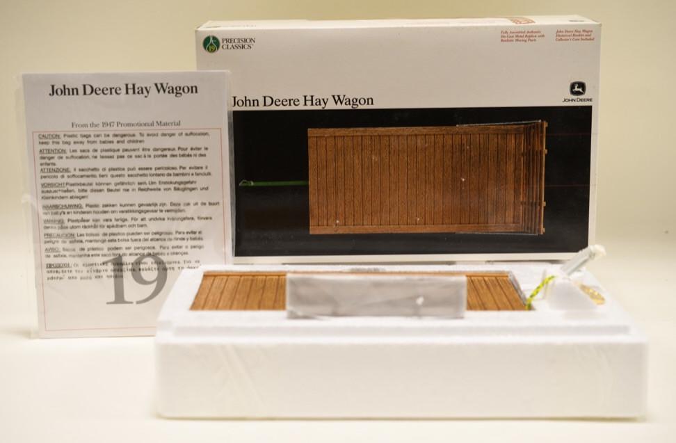 1/16 Ertl Precision #19 John Deere Hay Wagon: Nice 1/16 scale Ertl precision #19 John Deere hay wagon. Appears to be new in the box. Nice condition. Box has wear from storage and display.