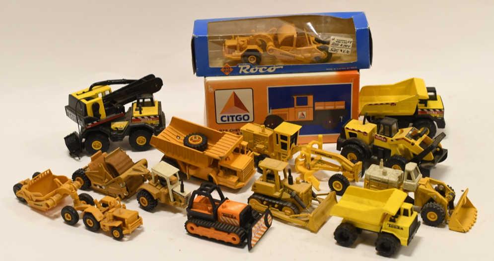 Lot of Tonka and Ertl Construction Equipment: Nice lot of small scale Tonka, Ertl, and other brands of construction equipment. All display nicely with some wear from play and age.